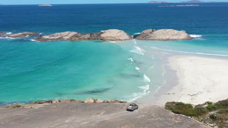 Excellent-Aerial-Shot-Of-A-Truck-Driving-Towards-The-Beach-On-Wylie-Bay,-Esperance,-Australia