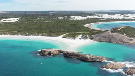 Excellent-Aerial-Shot-Of-A-Small-Boat-Anchored-Off-The-Shore-Of-Wylie-Bay,-Esperance,-Australia