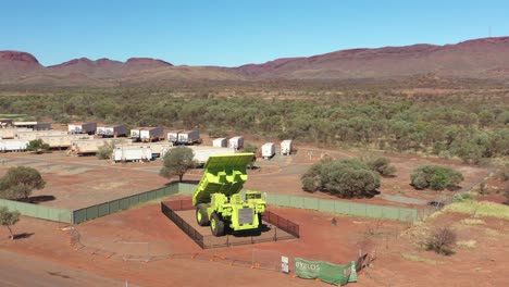 Excellent-Aerial-Shot-Of-A-Retired-Mining-Truck-In-The-Desert-Of-Paraburdoo,-Australia