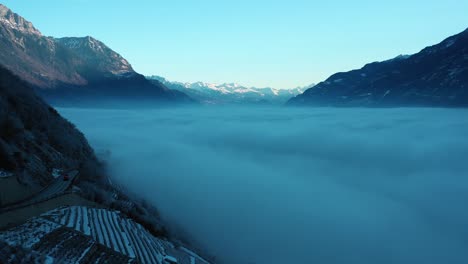 Excellent-Aerial-View-Of-A-Cloud-Blanket-Stretching-From-Martigny-To-Chamonix,-Switzerland
