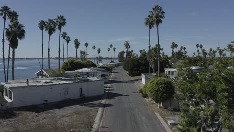 Excellent-Aerial-Shot-Moving-Through-A-Trailer-Park-Strewn-With-Palm-Trees