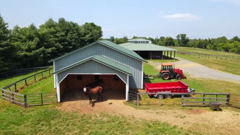 Excellent-Aerial-View-Of-Horses-Entering-Their-Barn-On-A-Farm-In-Leesburg,-Virginia