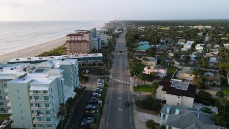 Excellent-Aerial-View-Of-Cars-Driving-By-New-Smyrna-Beach-In-Florida