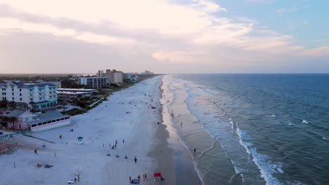 Excellent-Aerial-View-Of-People-On-New-Smyrna-Beach,-Florida,-At-Dusk