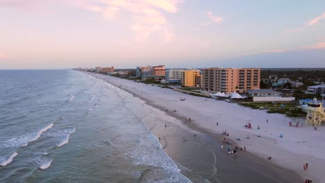 Excellent-Aerial-View-Of-People-On-New-Smyrna-Beach,-Florida,-At-Sunset