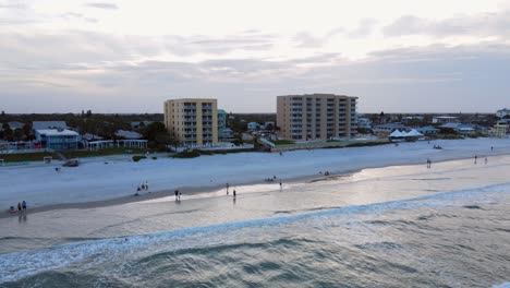 Excellent-Aerial-View-Pulling-Back-From-New-Smyrna-Beach,-Florida,-At-Dusk