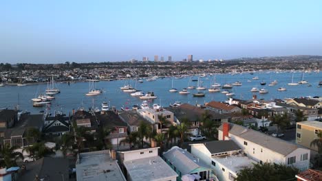 Excellent-Aerial-View-Of-Small-Boats-Docked-On-Balboa-Island,-California