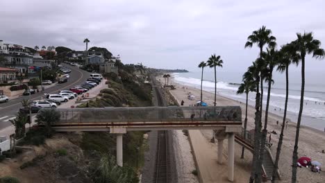 Excellent-Aerial-View-Shot-From-The-Surfliner-Train-As-It-Moves-Down-The-Beach-Of-San-Clemente,-California