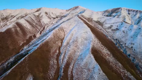 Excellent-Aerial-Shot-Of-A-Brown,-Wintry-Mountain-Range