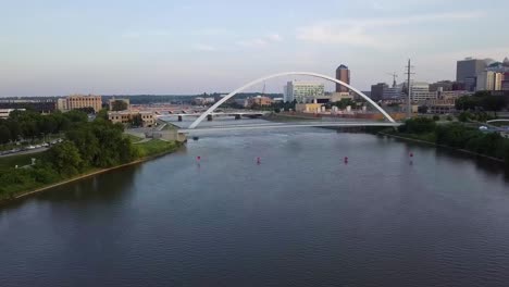 Aerial-Drone-Footage-Of-The-Des-Moines-River,-Bridges-And-Streets-And-High-Rise-Buildings-Of-Downtown-Des-Moines-Iowa