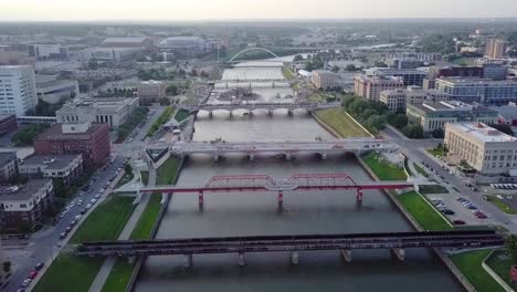 Aerial-Drone-Footage-Of-The-Des-Moines-River,-Bridges-And-A-Construction-Site-Near-Downtown-Des-Moines-Iowa