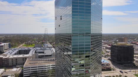 Aerial-Drone-Footage-Mirrored-Glass-High-Rise-Office-Building-With-Storm,-High-Wind-Damage-And-Broken-Windows-In-Iowa