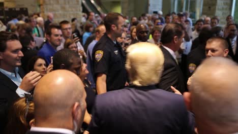 Us-Republican-Presidential-Candidate-Donald-Trump-Shakes-Hands-With-A-Crowd-Of-Supporters-After-An-Event-During-The-Iowa-Caucus-Policital-Campaign
