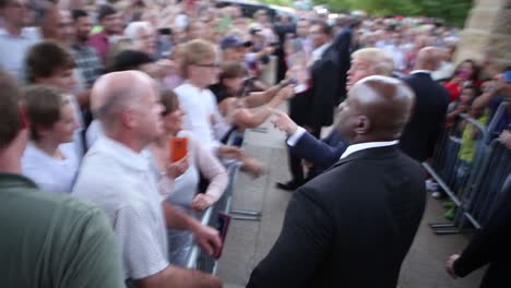 Us-Republican-Presidential-Candidate-Donald-Trump-Shakes-Hands-And-Signs-Autographs-Forsupporters-After-An-Iowa-Caucus-Policital-Campaign-Event