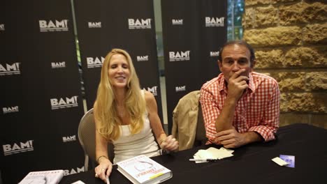Conservative-Woman-Commentator-Ann-Coulter-Sits-In-Front-Of-A-Bam!-(Books-A-Million)-Banner,-Waiting-To-Signc-Copies-Of-Adios-America!