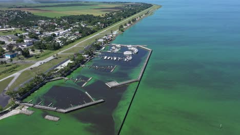 Excellent-Aerial-Shot-Of-The-Algae-Covered-Marina-At-Lake-Okeechobee,-Florida