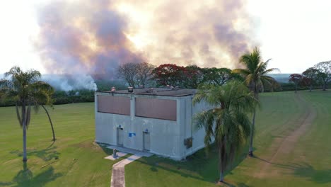 Excellent-Aerial-Shot-Of-A-Sugar-Cane-Field-Burning-In-Florida-Near-A-Playground