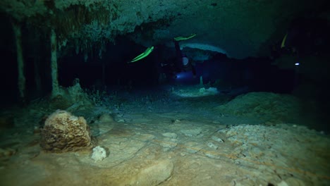 Divers-Swim-Through-A-Tight-Tunnel-Off-The-Coast-Of-Mexico'S-Yucatan-Peninsula