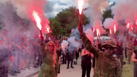 A-Crowd-Lights-Flares-To-Honor-A-Dead-Soldier-In-Ukraine-At-His-Funeral