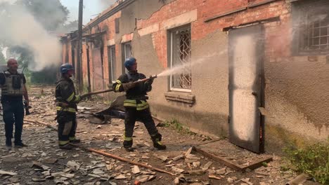 Firemen-Respond-As-A-Building-Burns-During-An-Attack-On-Mykolaiv,-Ukraine-On-The-Front-Line-Of-The-War-In-Ukraine