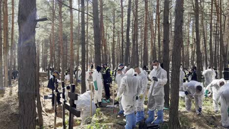 War-Crimes-Investigators-Exhume-Bodies-And-Record-Evidence-From-Mass-Graves-In-Izium,-Ukraine-Following-The-Regions-Liberation-From-Russian-Occupation