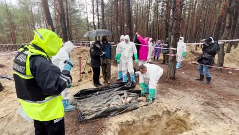 War-Crimes-Investigators-Exhume-Bodies-And-Record-Evidence-From-Mass-Graves-In-Izium,-Ukraine-Following-The-Regions-Liberation-From-Russian-Occupation