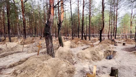 Mass-Graves-Suggest-Russian-War-Crimes-And-Genocide-In-A-Forest-In-Izium,-Ukraine-Following-The-Regions-Liberation