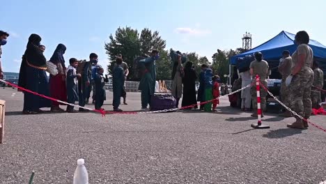 Afghan-Refugees-Are-Processed-And-Given-Covid-Tests-At-Ramstein-Airbase-In-Germany