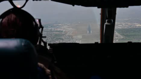 Pov-Shot-From-The-Cockpit-Of-A-C-17-Globemaster-Landing-At-Hamid-Karzai-Airport-In-Kabul-Afghanistan-During-The-American-Evacuation