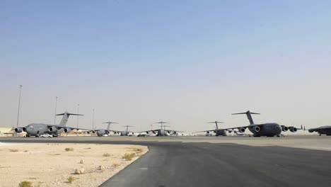Large-Numbers-Of-Us-C-17-Globemasters-Sit-On-A-Runway-At-Al-Udeid-Base-In-Doha,-Qatar-Waiting-To-Evacuate-Refugees-And-Evacuees-From-Afghanistan
