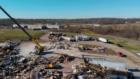 Aerial-Emergency-Rescue-Workers-Search-Rubble-Of-Mayfield-Consumer-Products-Candle-Factory-After-It-Was-Destroyed-During-A-Massive-Tornado-In-Kentucky