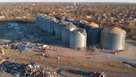 Shocking-Aerial-Over-Multiple-Destroyed-Grain-Elevators-In-The-Town-Of-Mayfield-Kentucky-Following-A-Devastating-Tornado