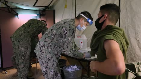 3Rd-Marine-Division-Marines-And-Sailors-Are-Innoculated-With-The-Covid-19-Antibody-Vaccine-In-Okinawa,-Japan