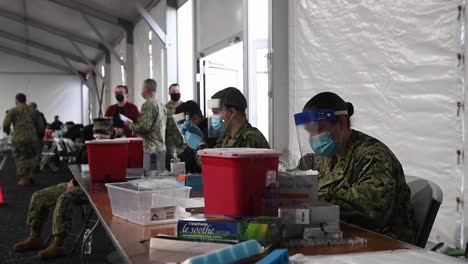 Us-Navy-Sailors-Prepare-And-Deliver-Covid-19-Shots,-Vaccines-Jacksonville-Community-Vaccination-Center,-Fl