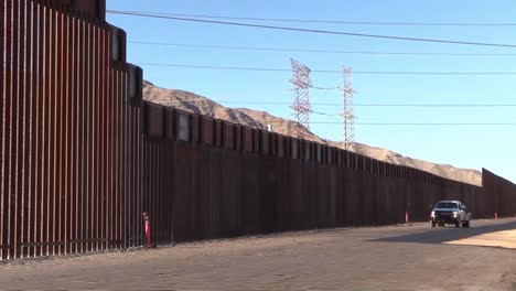Border-Wall-With-Mexico-Height-Reduction-To-Accomodate-Existing-Power-Lines-Near-Calexico,-Ca