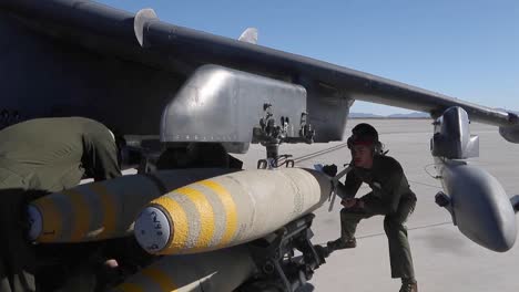 Us-Marine-Corps-Ordnance-Technicians-Load-Bombs-Onto-A-Av-8B-Harrier-Ii,-Air-Station-Yuma,-Arizona