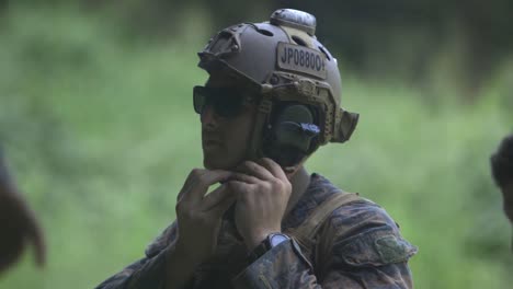 Camouflaged-Us-And-Phillipine-Marines-Prepare-To-Practice-Their-Automatic-Weapons-Marksmanship-Skills