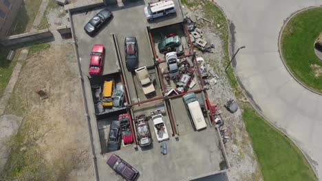 Aerial-Drone-Footage,-Soldiers-Conduct-Vehicle-Extraction-Techniques-At-The-Muscatatuck-Urban-Training-Center,-In