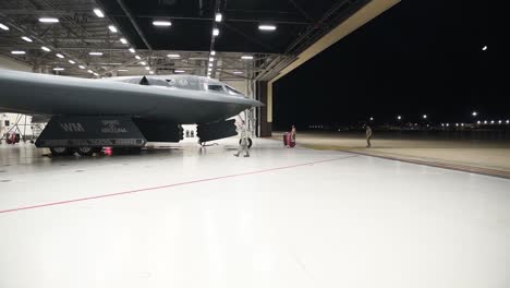 A-Northrop-B-2-Spirit-Stealth-Bomber-Taxis-On-A-Runway-And-Parks-In-A-Hanger-For-Ground-Crew-Maintenance