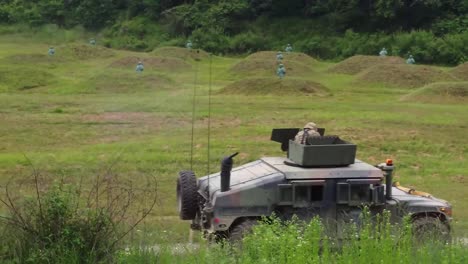 Aerial-Drone-Footage-Of-Humvees-25Th-Transportation-Battalion-Soldiers-Practice-Shooting-Targets,-Convoy-Live-Machine-Gun-Fire-Training-Exercise,-Korea
