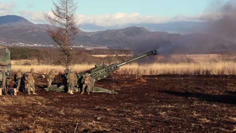 3Rd-Marine-Division-Soldiers-Fire-Howitzers-During-An-Artillery-Relocation-Training-Exercise-At-Camp-Fuji,-Japan