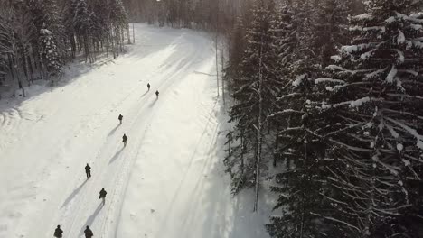 Drone-Shot-And-Slow-Motion,-British-And-Estonian-Soldiers-Train-In-Extreme-Cold-Weather,-Nato-Exercise-Winter-Camp