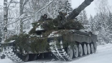 Slow-Motion,-British-Army-Challenger-2-Tanks-Drive-Through-Estonia-Forest-During-Nato’S-Exercise-Winter-Camp
