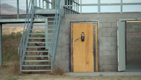 Combat-Engineers-Breach-A-Door-Using-Small-Explosives-Before-Entering-A-Block-Building-During-Training,-Camp-Pendleton