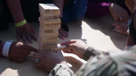 Us-Air-Force-Airmen-Play-Jinga-With-Afgani-Children,-Awaiting-Processing-After-Evacuation-From-Kabul-By-Biden-Administration,-Ramstein-Afb,-Germany