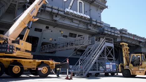 A-Crane-Removes-A-Gantry-While-Preparing-For-The-Departure-Of-The-Uss-Carl-Vinson,-Deploying-From-San-Diego