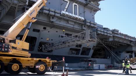 A-Crane-Removes-A-Gantry-While-Preparing-For-The-Departure-Of-The-Uss-Carl-Vinson,-Deploying-From-San-Diego