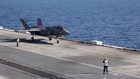 Italian-Jet-Fighter-Taxis-During-A-Cross-Dock-Operation,-Hms-Queen-Elizabeth-And-Its-Cavour,-Mediterranean-Sea