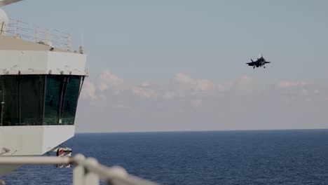 Italian-Jet-Fighter-Lands-During-A-Cross-Dock-Operation,-Hms-Queen-Elizabeth-And-Its-Cavour,-Mediterranean-Sea