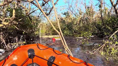 Coast-Guard-Dingy-In-A-Sanibel-Island,-Florida-Storm-Damaged-Canal-During-A-Search-And-Rescue-Operation,-Hurricane-Ian